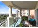 Relaxing balcony with seating area, offering scenic views at 7593 Gathering Dr # 802, Reunion, FL 34747