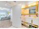 Double vanity bathroom with marble finishes and a view to the bedroom at 7593 Gathering Dr # 802, Reunion, FL 34747