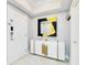 Stylish entryway with a statement mirror and gold accents at 7593 Gathering Dr # 802, Reunion, FL 34747