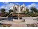 Luxury building with fountain and landscaping at 7593 Gathering Dr # 802, Reunion, FL 34747