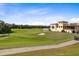 Stunning golf course with clubhouse in the background at 7593 Gathering Dr # 802, Reunion, FL 34747