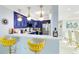 Stylish kitchen with blue cabinets and breakfast bar at 7593 Gathering Dr # 802, Reunion, FL 34747