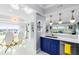 Modern kitchen with blue cabinetry and breakfast bar at 7593 Gathering Dr # 802, Reunion, FL 34747
