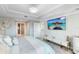 Luxurious main bedroom with ensuite access and a large TV at 7593 Gathering Dr # 802, Reunion, FL 34747