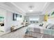 Bright main bedroom featuring a large TV and comfortable bed at 7593 Gathering Dr # 802, Reunion, FL 34747