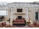Relaxing rooftop patio with fireplace, seating area, and city views at 7593 Gathering Dr # 802, Reunion, FL 34747