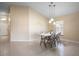 Simple dining area with a table and chairs, situated in a bright and open space at 111 Windy Dune Ct, Kissimmee, FL 34743