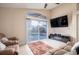Spacious living room featuring sliding doors that offer a view of the pool at 111 Windy Dune Ct, Kissimmee, FL 34743
