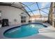 Inviting pool area enclosed by a screened lanai at 111 Windy Dune Ct, Kissimmee, FL 34743