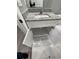 White vanity with granite countertop and storage at 1170 S Central Ave, Apopka, FL 32703