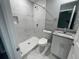 Modern bathroom with white vanity, granite countertop, and marble shower at 1170 S Central Ave, Apopka, FL 32703
