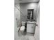 Updated bathroom with shower and granite vanity at 1170 S Central Ave, Apopka, FL 32703