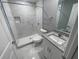 Updated bathroom with shower, toilet, and granite vanity at 1170 S Central Ave, Apopka, FL 32703