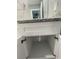 White bathroom vanity with granite countertop and ample storage at 1170 S Central Ave, Apopka, FL 32703