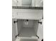 White bathroom vanity with granite countertop and storage at 1170 S Central Ave, Apopka, FL 32703