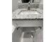 White bathroom vanity with granite countertop and storage at 1170 S Central Ave, Apopka, FL 32703