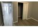 Bedroom with mirrored closet doors and vinyl flooring at 1170 S Central Ave, Apopka, FL 32703