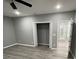 Spacious bedroom with grey walls, wood-look floors, and a large closet at 1170 S Central Ave, Apopka, FL 32703