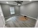 Spacious bedroom with gray walls, vinyl flooring, and ceiling fan at 1170 S Central Ave, Apopka, FL 32703