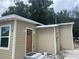 House exterior showcasing the front entrance and landscaping at 1170 S Central Ave, Apopka, FL 32703