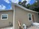 Tan house exterior with brown door and window at 1170 S Central Ave, Apopka, FL 32703