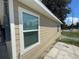 Side view of tan house with window and white trim at 1170 S Central Ave, Apopka, FL 32703