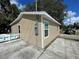 Tan house exterior with white trim and window at 1170 S Central Ave, Apopka, FL 32703