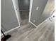 Bright hallway with grey walls and wood-look floors at 1170 S Central Ave, Apopka, FL 32703