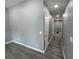 Clean and spacious hallway with grey walls and luxury vinyl flooring at 1170 S Central Ave, Apopka, FL 32703