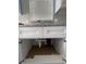 White kitchen cabinets with granite countertops and sink at 1170 S Central Ave, Apopka, FL 32703