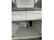 Under-sink plumbing and garbage disposal in a newly remodeled kitchen at 1170 S Central Ave, Apopka, FL 32703