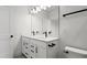 Modern bathroom with double vanity and updated fixtures at 15142 Grove Lake Dr, Winter Garden, FL 34787