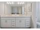 Double vanity bathroom with modern white cabinets at 159 Golden Noble St, Kissimmee, FL 34747