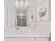 Modern bathroom with a vanity, a large mirror, and a walk-in shower at 159 Golden Noble St, Kissimmee, FL 34747