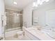 Clean bathroom with a tub, shower, vanity and mirror at 159 Golden Noble St, Kissimmee, FL 34747
