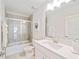 Bathroom with white vanity, bathtub and shower at 159 Golden Noble St, Kissimmee, FL 34747