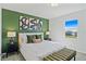Bright bedroom with a king-size bed and stylish decor at 159 Golden Noble St, Kissimmee, FL 34747