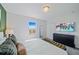 Spacious bedroom with a king-size bed and TV at 159 Golden Noble St, Kissimmee, FL 34747