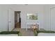 Bedroom with a desk, chair, and view into a hallway at 159 Golden Noble St, Kissimmee, FL 34747