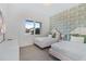 Twin bedroom with green accent wall and window at 159 Golden Noble St, Kissimmee, FL 34747