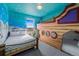 Fun ' bedroom featuring a Spongebob-themed mural and a custom boat bunk bed at 159 Golden Noble St, Kissimmee, FL 34747