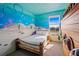 ' bedroom with a Spongebob-themed mural and a wooden boat bed at 159 Golden Noble St, Kissimmee, FL 34747