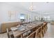 Elegant dining room with long wooden table and seating at 159 Golden Noble St, Kissimmee, FL 34747