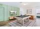 Game room with pool table and large TV at 159 Golden Noble St, Kissimmee, FL 34747