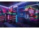 Game room with Playstation 5, exercise equipment, and vibrant wall art at 159 Golden Noble St, Kissimmee, FL 34747
