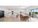 Open concept kitchen with island and large dining table at 159 Golden Noble St, Kissimmee, FL 34747