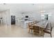 Open concept kitchen features island and large dining table at 159 Golden Noble St, Kissimmee, FL 34747