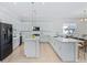 Open concept kitchen with island, stainless steel appliances, and breakfast nook at 159 Golden Noble St, Kissimmee, FL 34747