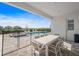 Outdoor patio with white table and chairs, overlooking the pool at 159 Golden Noble St, Kissimmee, FL 34747