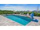 Relaxing pool area with a spa, lounge chairs, and a basketball hoop at 159 Golden Noble St, Kissimmee, FL 34747